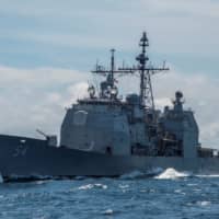 The guided-missile cruiser USS Antietam is seen in the South China Sea in March 2016. | REUTERS