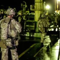 British soldiers are seen during an operation involving the oil supertanker Grace 1 in waters off the British overseas territory of Gibraltar on July 4. | UK MINISTRY OF DEFENSE / HANDOUT / VIA REUTERS