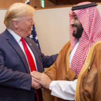 Saudi Crown Prince Mohammed bin Salman shakes hands with U.S. President Donald Trump during their meeting on the sidelines of the Group of 20 summit in Osaka on Saturday. | AFP-JIJI
