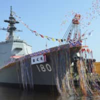The Haguro, the Maritime Self-Defense Force\'s newest Aegis-equipped destroyer, is launched at a shipyard in Yokohama on Wednesday. | ?¯