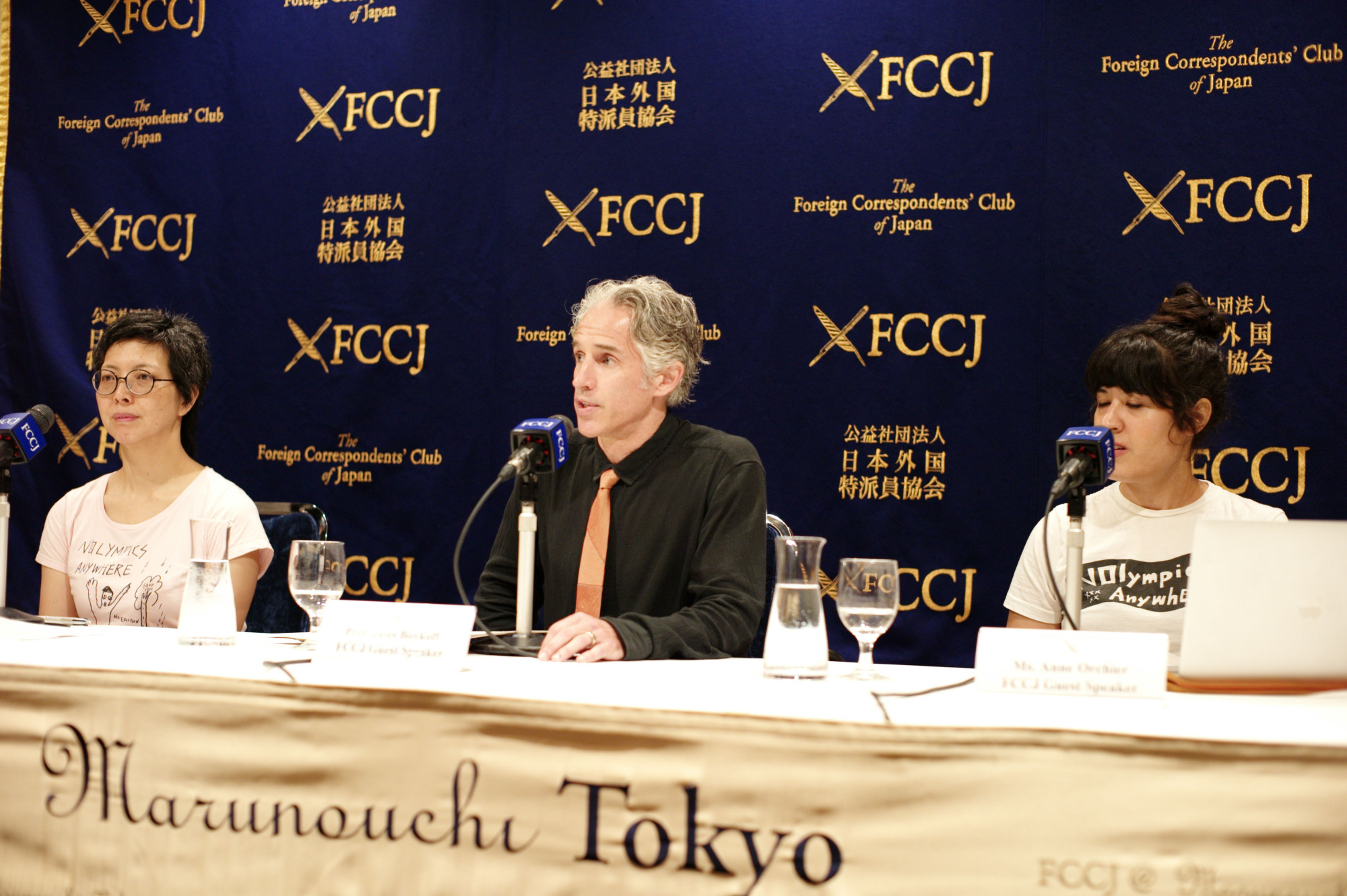 Anti-Olympic activist and former soccer player Jules Boykoff (center) speaks during a news conference in Tokyo with Misako Ichimura (left) of Hangorinnokai (No Olympics 2020) and Annie Orchier, an organizing member with NOlympics LA. | RYUSEI TAKAHASHI