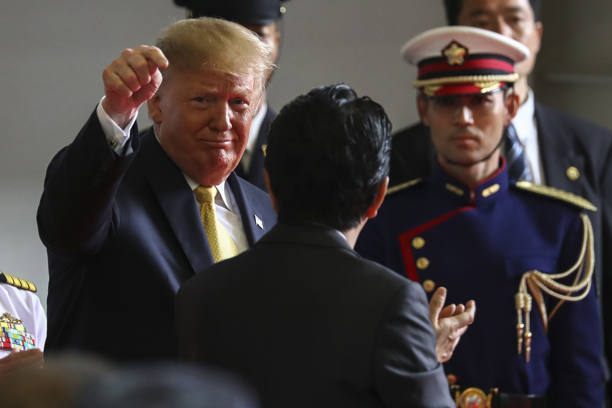 U.S. President Donald Trump talks with Prime Minister Shinzo Abe aboard the MSDF helicopter carrier Kaga at the U.S. naval base in Yokosuka, Kanagawa Prefecture, in May. | BLOOMBERG