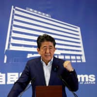 Prime Minister Shinzo Abe, who is also leader of the Liberal Democratic Party, gestures during a news conference a day after Sunday\'s Upper House election at LDP headquarters in Tokyo. | REUTERS
