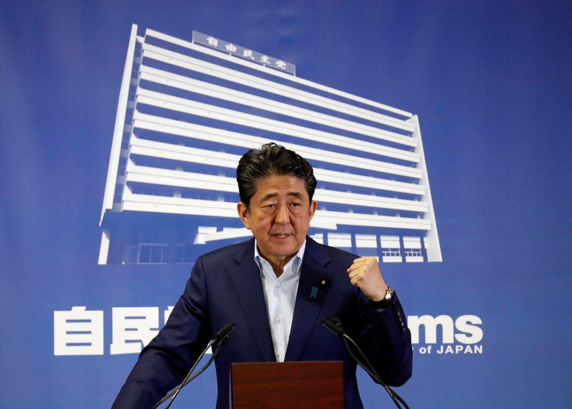 Prime Minister Shinzo Abe, who is also leader of the Liberal Democratic Party, gestures during a news conference a day after Sunday's Upper House election at LDP headquarters in Tokyo. | REUTERS
