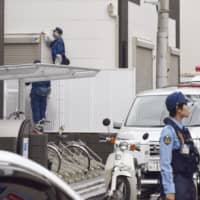 Police investigate a home where a where a 17-year-old high school student was stabbed in Warabi, Saitama Prefecture, by a suspected intruder Tuesday. | KYODO