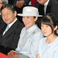This photo, taken in August 2016, shows then-Crown Prince Naruhito, Crown Princess Masako and their only child, Princess Aiko, attending a symposium in Tokyo on water issues. | KYODO