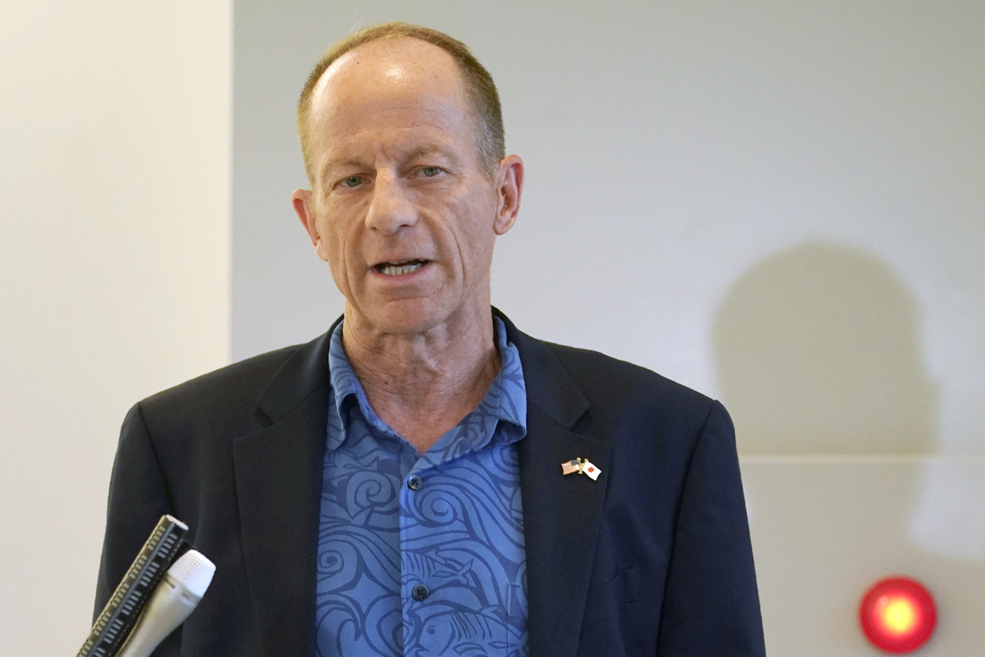 U.S. Assistant Secretary of State for East Asian and Pacific Affairs David Stilwell speaks to waiting media as he arrives at Narita International Airport in Narita, Chiba Prefecture, on Thursday. | AP