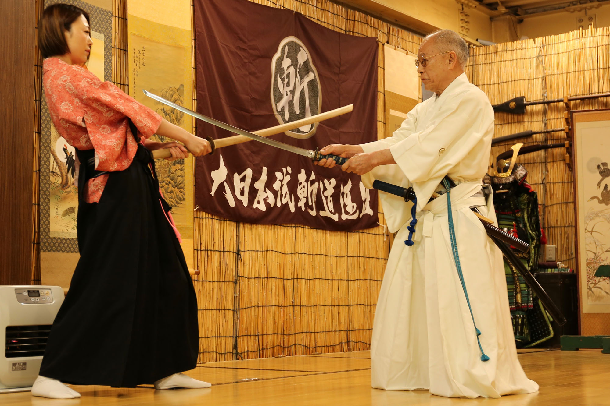 The way of the warrior: Sword master Seto Tenyu Hirotoshi teaches a student at the dojo of Yushindou in Osaka. | KIT NAGAMURA