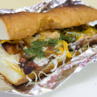 Big, bold flavor: Chao\'s chicken baguette kebab comes topped with cabbage and onion. | TSUYOSHI TAGAWA
