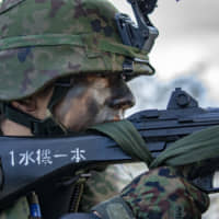 A member of the Self-Defense Forces participates in the Talisman Sabre 2019 drill in Australia on July 21. Japan is expanding its participation in multilateral military exercises. | U.S. ARMY PACIFIC PUBLIC AFFAIRS OFFICE