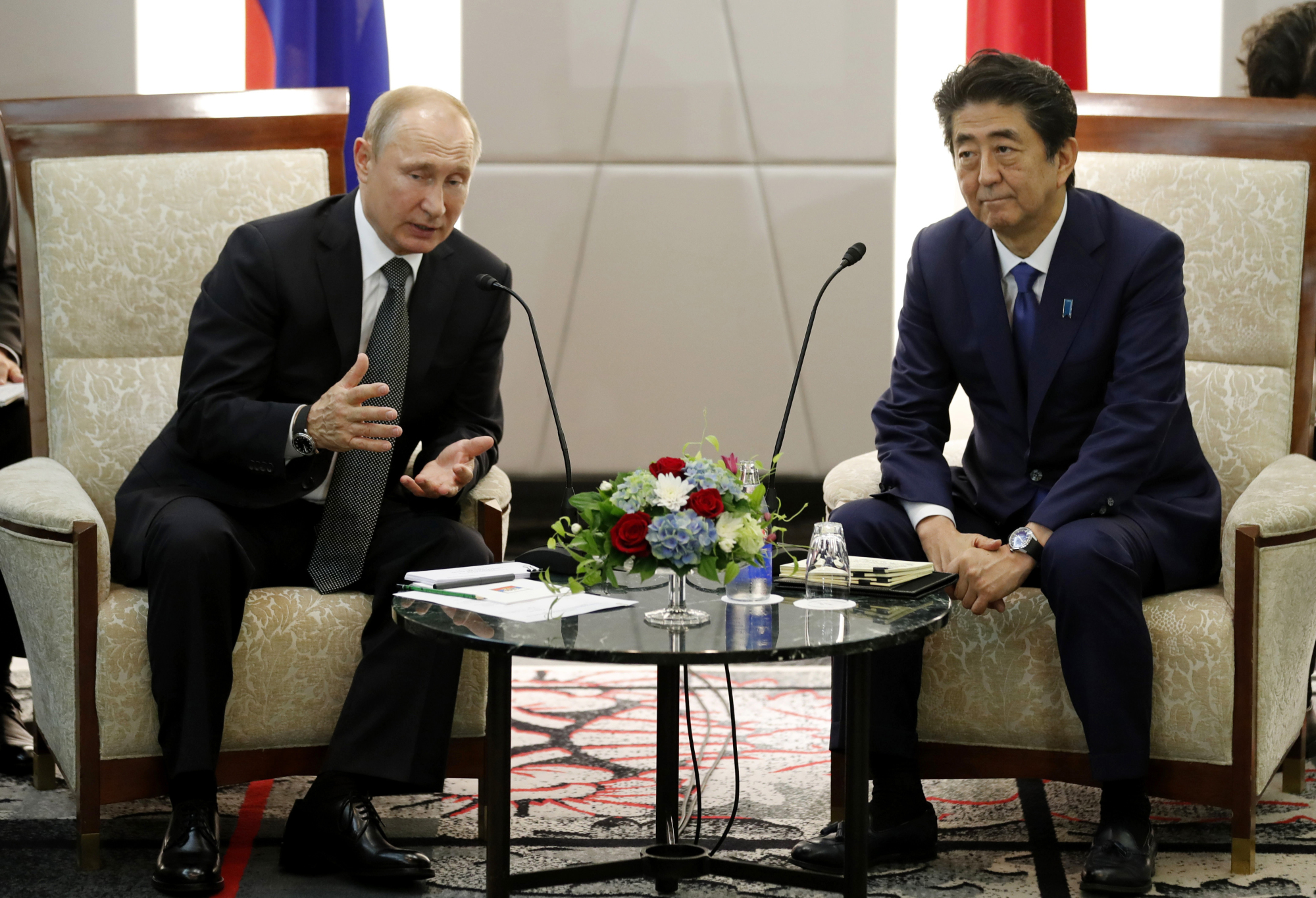 Prime Minister Shinzo Abe, shown here meeting Russian President Vladimir Putin on the sidelines of the Group of 20 summit in Osaka last month, has struggled to achieve progress on the Northern Territories dispute. | BLOOMBERG