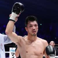 Ryota Murata celebrates his victory over WBA middleweight champion Rob Brant on Friday in Osaka. | AFP-JIJI