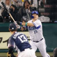 CL All-Star Yoshitomo Tsutsugo of the BayStars bashes a three-run home run in the second inning of Saturday\'s game at Koshien Stadium. | KYODO