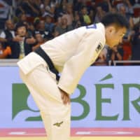 Three-time men\'s 73-kg champion Masashi Ebinuma reacts to his loss on the second day of the Budapest Grand Prix. | KYODO