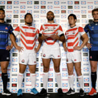 (From left) Timothy Lafaele, Shota Horie, Michael Leitch, Kenki Fukuoka and Wimpie van der Walt model the new Japan uniforms for the Rugby World Cup. | YOSHIAKI MIURA