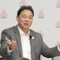Katsuyuki Kiyomiya (left), a Japan Rugby Football Union vice president, and JRFU board member Masaki Sakaida face the media during a Tokyo news conference on Sunday. | KAZ NAGATSUKA