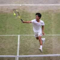 Shintaro Mochizuki, seen in action in the Wimbledon boys\' singles final on Sunday against Spain\'s Carlos Gimeno Valero, is now No. 1 in the world junior rankings. | REUTERS