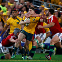 The Wallabies\' James O\'Connor (center) is tackled by the British and Irish Lions\' Jonathan Davies (left) and Sean O\'Brien during a test match in Sydney in July 2013. | REUTERS