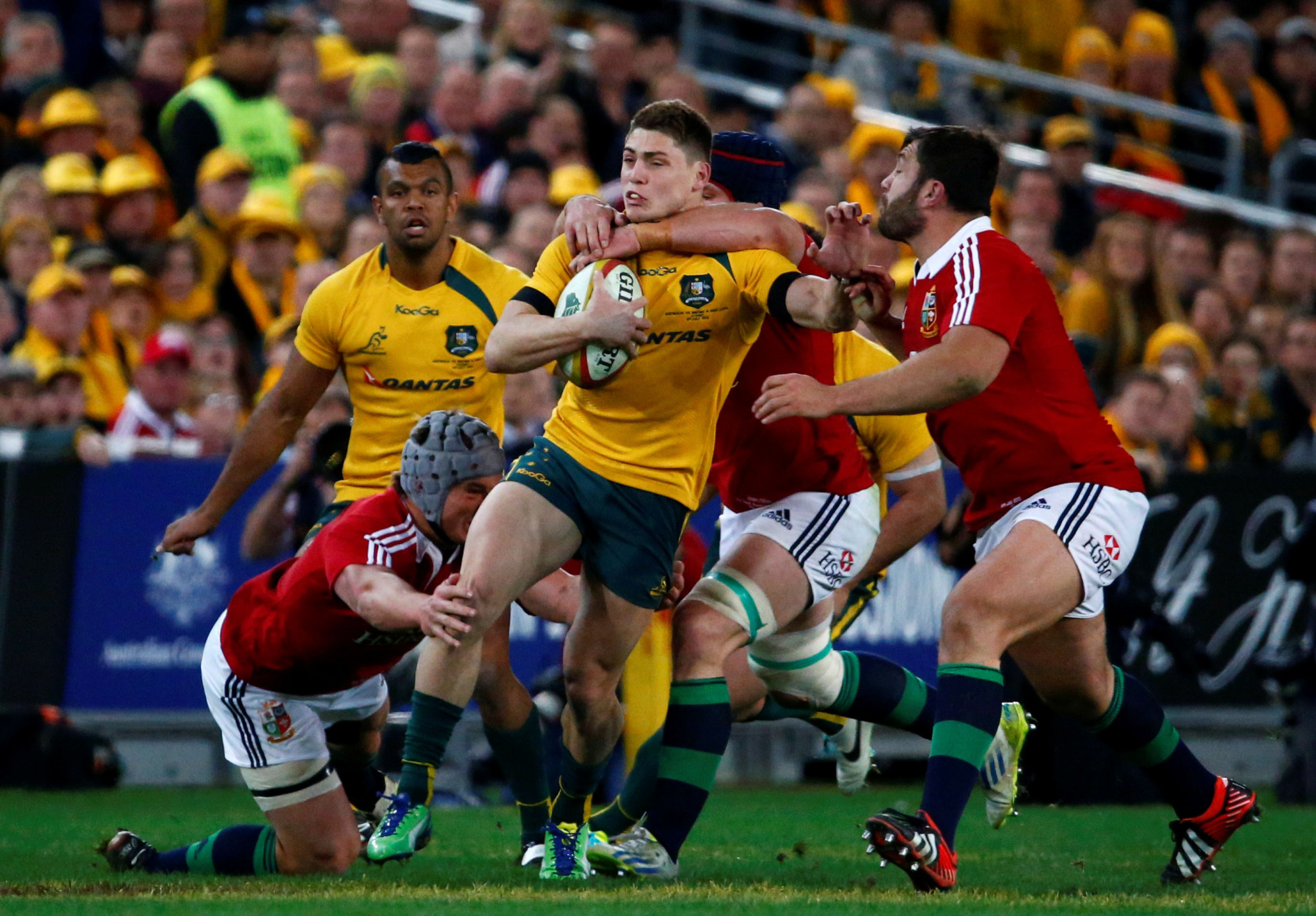 The Wallabies' James O'Connor (center) is tackled by the British and Irish Lions' Jonathan Davies (left) and Sean O'Brien during a test match in Sydney in July 2013. | REUTERS