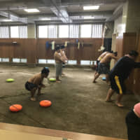 Wrestlers at the Tamanoi stable participate in non-traditional training drills in October 2016. | JOHN GUNNING