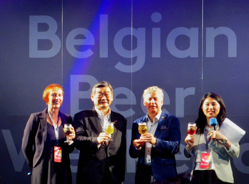 At Belgian Beer Weekend 2019 (which runs until July 7), Belgian Beer Weekend Committee Honorary Chairman and Belgian Ambassador Gunther Sleeuwagen (second from right) poses with Konishi Brewing Co. President and Belgian Beer Weekend Committee Chairman Shintaro Konishi (second from left), and BB Navigators Nele Duprix (far left) and Shiho Shingu during a Belgian beer toast at the event's opening ceremony at Tokyo's Hibiya Park on June 27. | HIROKO INOUE