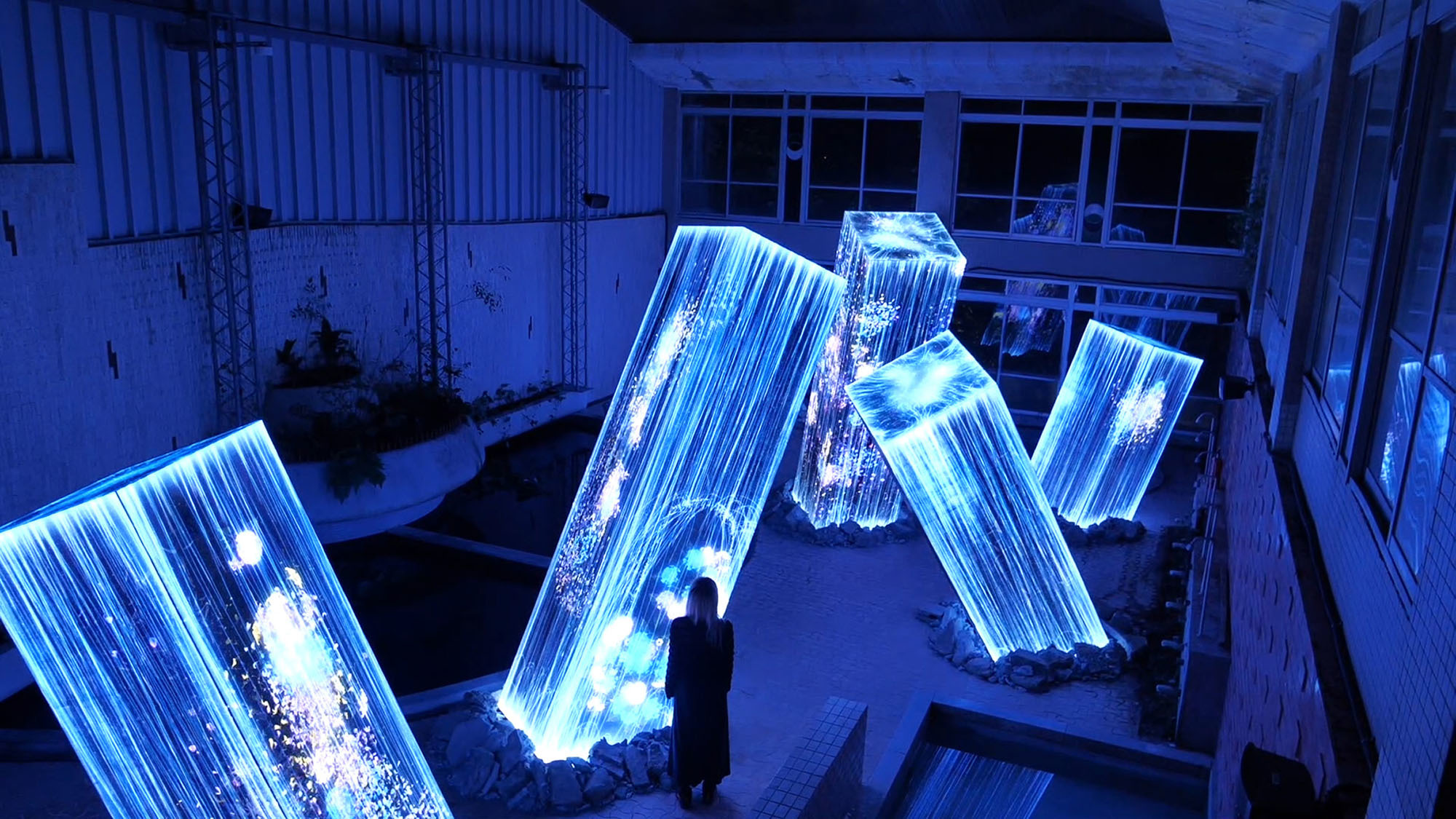 A visitor experiences a new interactive exhibit titled 'Megaliths in the Bath House Ruins' at the massive Mifuneyama Rakuen park in Saga Prefecture. The piece is part of a larger collection of 'digitized nature' displays by art collective teamLab named 'A Forest Where Gods Live.' The large-scale show, which opened Friday for its fifth year at the park, will continue until Nov. 4. | CHISATO TANAKA