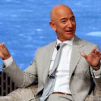 Jeff Bezos, founder of Amazon and Blue Origin, speaks at the John F. Kennedy Library in Boston in June. | REUTERS