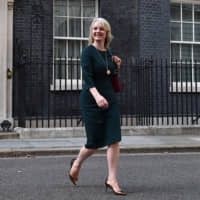 British trade secretary Liz Truss leaves No. 10 Downing St. on July 24. Truss spoke with Minister of Economy, Trade and Industry Hiroshige Seko by telephone Tuesday to discuss trade issues. | GETTY IMAGES