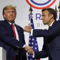 French President Emmanuel Macron (right) and U.S. President Donald Trump hold a joint-press conference in Biarritz, southwest France Monday, on the third day of the annual G7 Summit attended by the leaders of the world\'s seven richest democracies. | AFP-JIJI