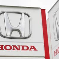 A Honda Motor Co. logo is seen in Tsukuba, Ibaraki Prefecture, on Feb. 13. Honda has decided to halt production in Argentina next year. | KYODO