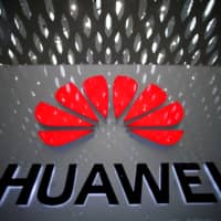 A Huawei company logo is pictured at the Shenzhen International Airport in Shenzhen, Guangdong province, China, in July. | REUTERS