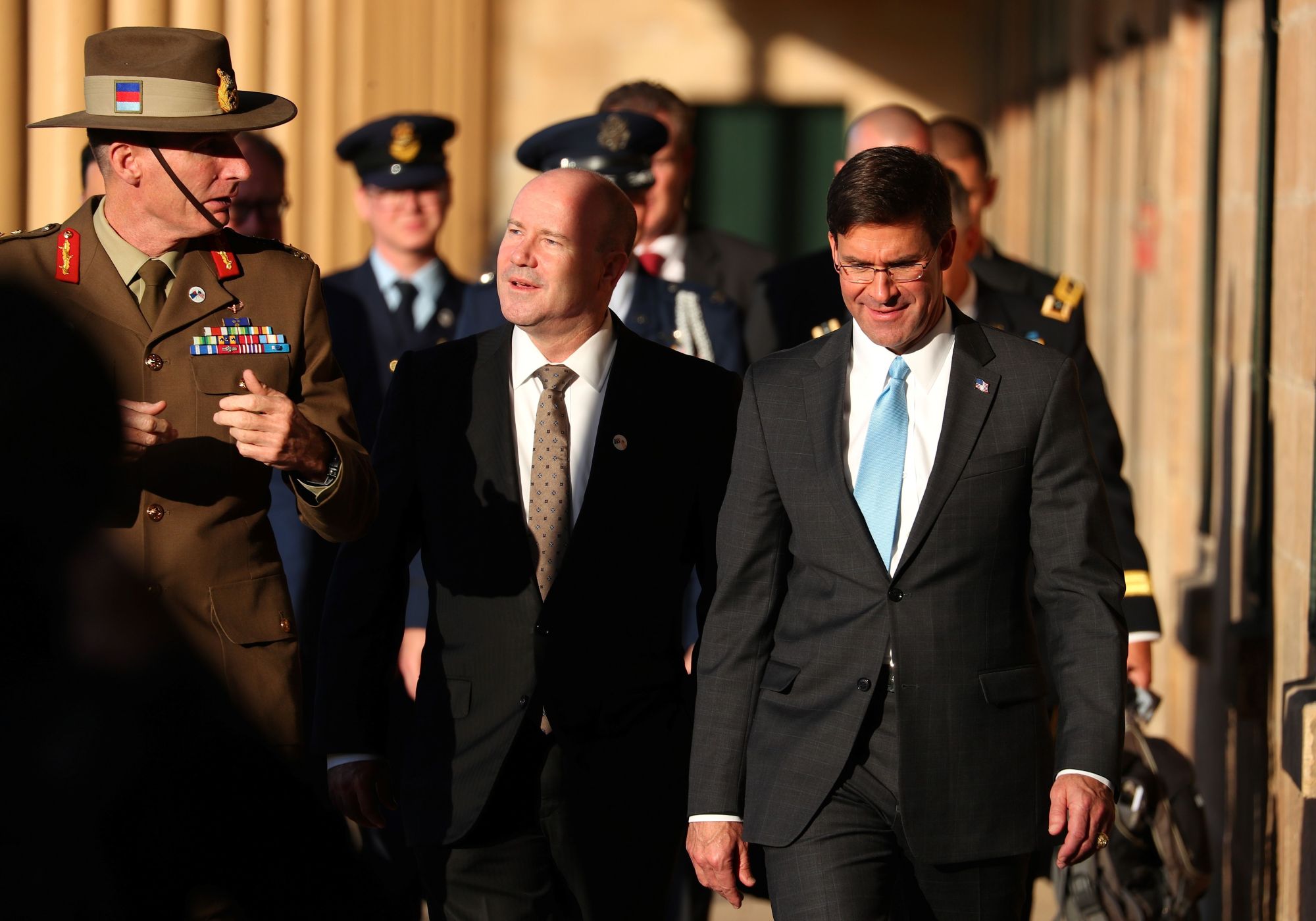 U.S. Secretary of Defense Mark Esper (right) walks with Australia's Chief of the Defence Force Gen. Angus Campbell (left) and Australian Secretary of the Department of Defense Greg Moriarty at Victoria Barracks in Sydney on Sunday. | AFP-JIJI