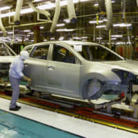 A production line at a subsidiary of Nissan Motor Co. in Kanda Town, Fukuoka Prefecture | KYODO