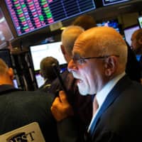 Traders work on the floor at the New York Stock Exchange (NYSE) in New York Monday. | REUTERS