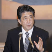 Prime Minister Shinzo Abe speaks during a news conference in Nagasaki on Friday. | KYODO