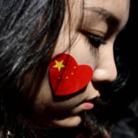 A pro-China activist participates in a march against the Hong Kong protests in Sydney on Saturday. | AFP-JIJI