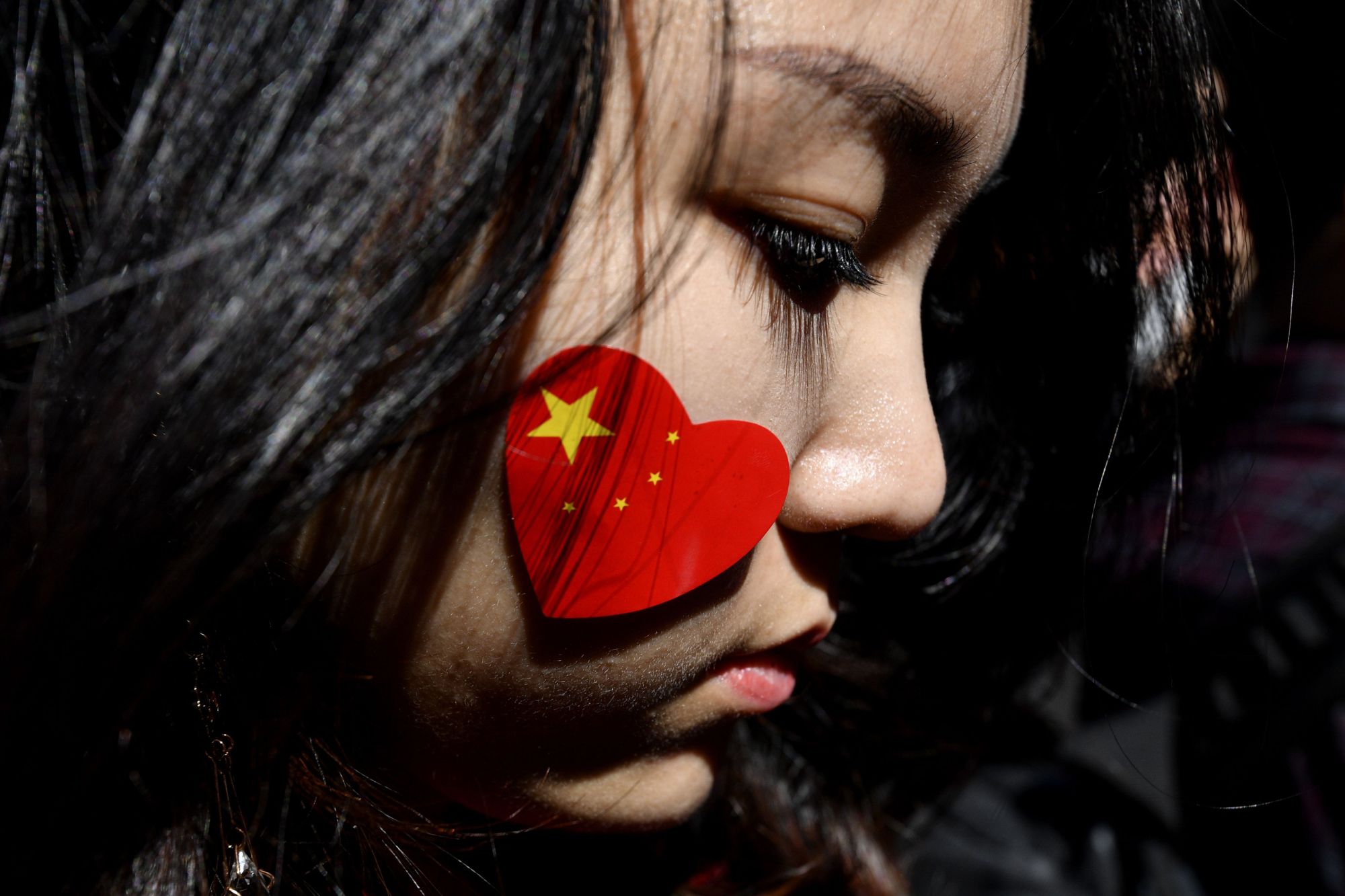 A pro-China activist participates in a march against the Hong Kong protests in Sydney on Saturday. | AFP-JIJI