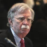 U.S. national security adviser John Bolton attends a conference of nations that largely support Venezuelan opposition leader Juan Guaido in Lima on Tuesday. | AP