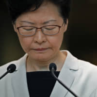 Hong Kong Chief Executive Carrie Lam pauses during a news conference in the city on Tuesday. | AP