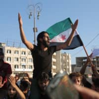 Syrians demonstrate against Russia\'s interference in their town of Khan Sheikhun, in the rebel-held city of Idlib in northwestern Syria on Tuesday. | AFP-JIJI