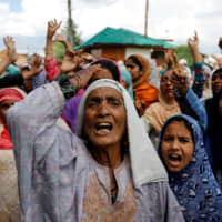 Kashmiri women shout slogans during a protest after the scrapping of the special constitutional status for Kashmir by the Indian government, in Srinagar, India, Sunday. | REUTERS