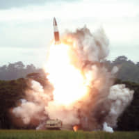 North Korea test-fires a new weapon, presumed to be a short-range ballistic missile, at an undisclosed location on Aug. 16. | KCNA /KNS / VIA AFP-JIJI