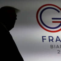 U.S. President Donald Trump arrives to a news conference at the end of the G7 summit in Biarritz, France, Monday. | REUTERS