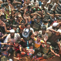 Rohingya refugees shout slogans against repatriation at the Unchiprang camp near Cox\'s Bazar, in Bangladesh last fall. Myanmar and Bangladesh are making a second attempt to start repatriating Rohingya Muslims after more than 700,000 of them fled a security crackdown in Myanmar almost two years ago, the U.N. refugee agency said Friday. | AP