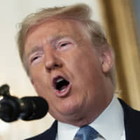 U.S. President Donald Trump speaks at the White House in Washington on Monday. Trump delivered his most forceful condemnation of racism and white supremacy and said he had ordered federal officials to work with social media companies to identify people who may perpetrate mass shootings before they can act. | BLOOMBERG