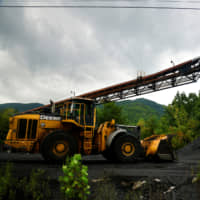 A mound of coal waits to be loaded at a coal transfer facility in Totz, Kentucky, on Aug. 13. | REUTERS