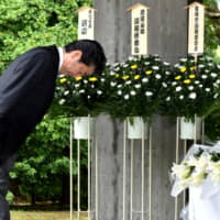 Prime Minister Shinzo Abe prays for the nation\'s war dead at the Chidorigafuchi National Cemetery in Tokyo on Thursday before attending an annual ceremony marking Japan\'s surrender in World War II later in the day. | SATOKO KAWASAKI