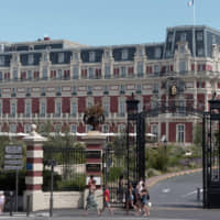 People pass by the Hotel du Palais where Group of Seven delegates will be hosted in Biarritz, southwestern France, ahead of the annual G7 summit from Saturday through Monday. | AFP-JIJI