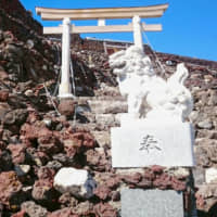 Stones near the summit of Mount Fuji are seen blocking a route to the summit after a typhoon last autumn. | YAMANASHI PREFECTURAL GOVERNMENT / VIA KYODO