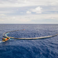 A U-shaped cleaning system designed to collect plastic waste is deployed in the Great Pacific Garbage Patch in June. | COURTESY OF THE OCEAN CLEANUP